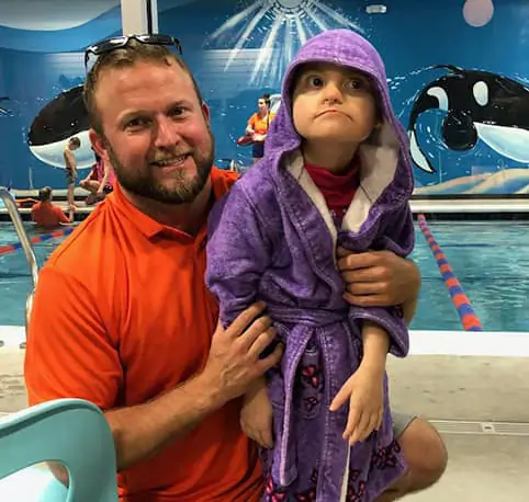 Briand and daughter near pool